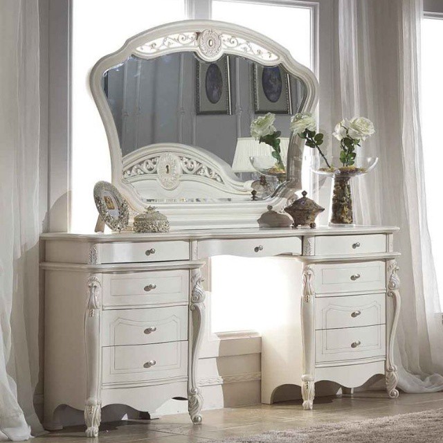 Stylistic infusion of a white dressing table with a mirror into the bedroom