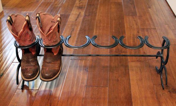 metal shelf in the shape of horseshoes