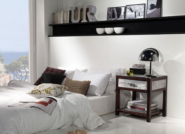 bedside table in a spacious bedroom