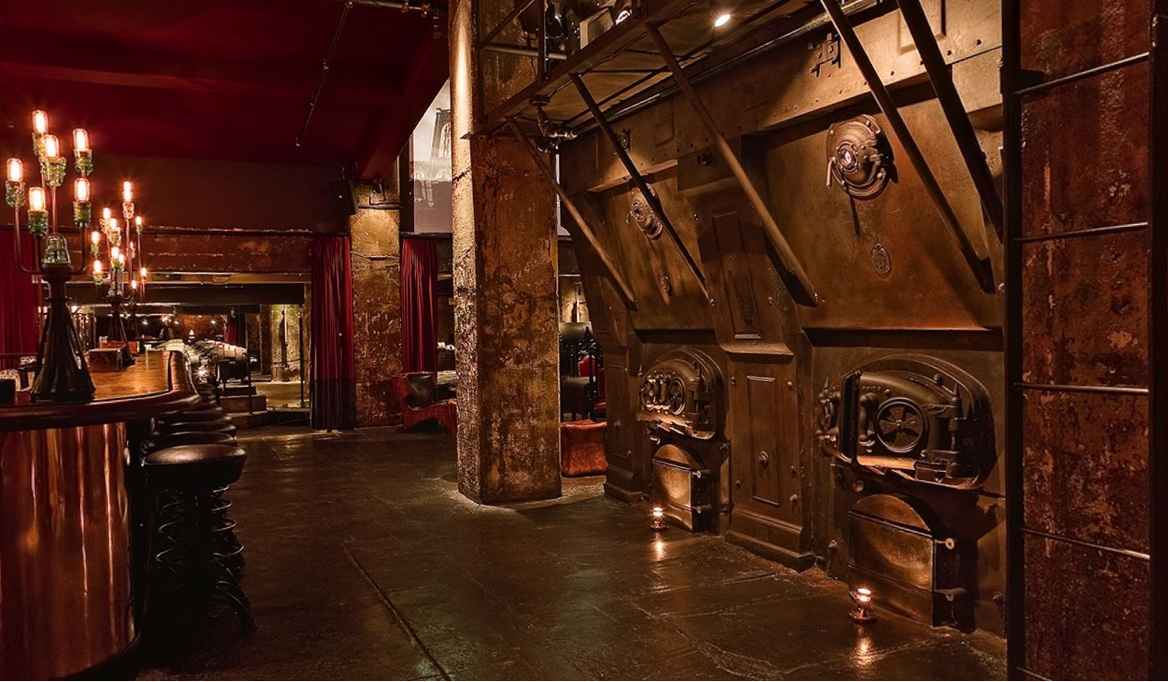 steampunk style bedroom with wood flooring