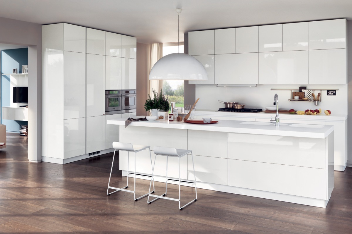 bright interior of a white kitchen with a touch of blue