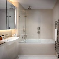 bright design of a bathroom with a shower in dark colors picture