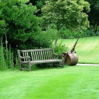 chic landscape decor of a summer house in the English style with trees photo