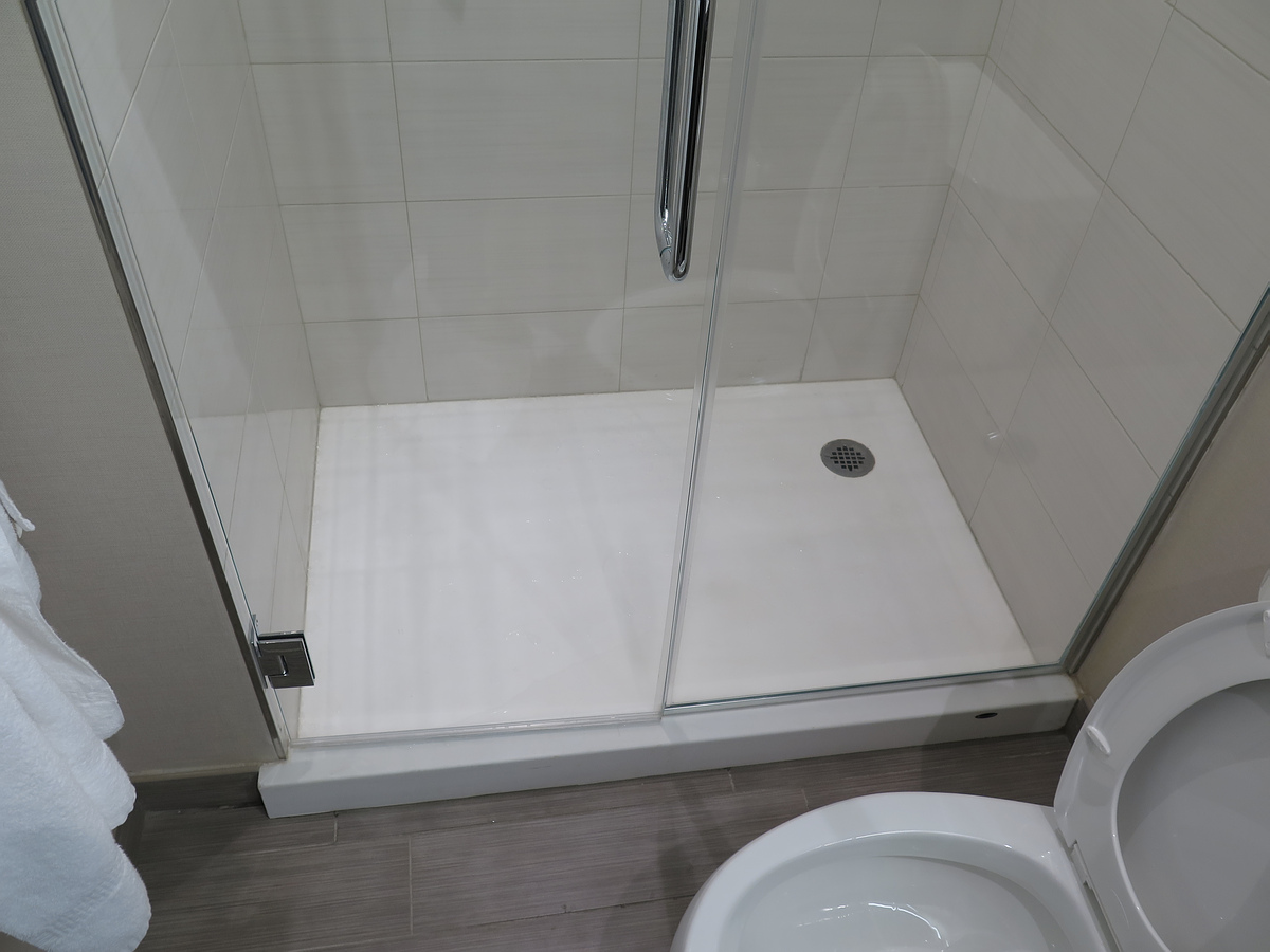 unusual interior of the bathroom with a shower in dark colors