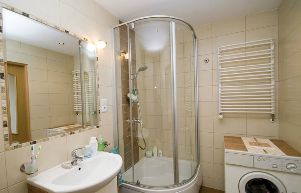 unusual design of a bathroom with a shower in bright colors