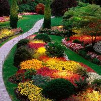 chic landscaping of a summer house in the English style with flowers picture