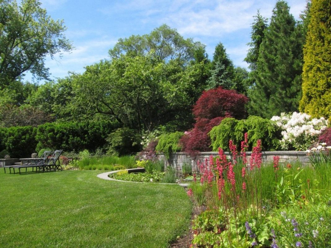 unusual landscaping of the garden in the English style with flowers