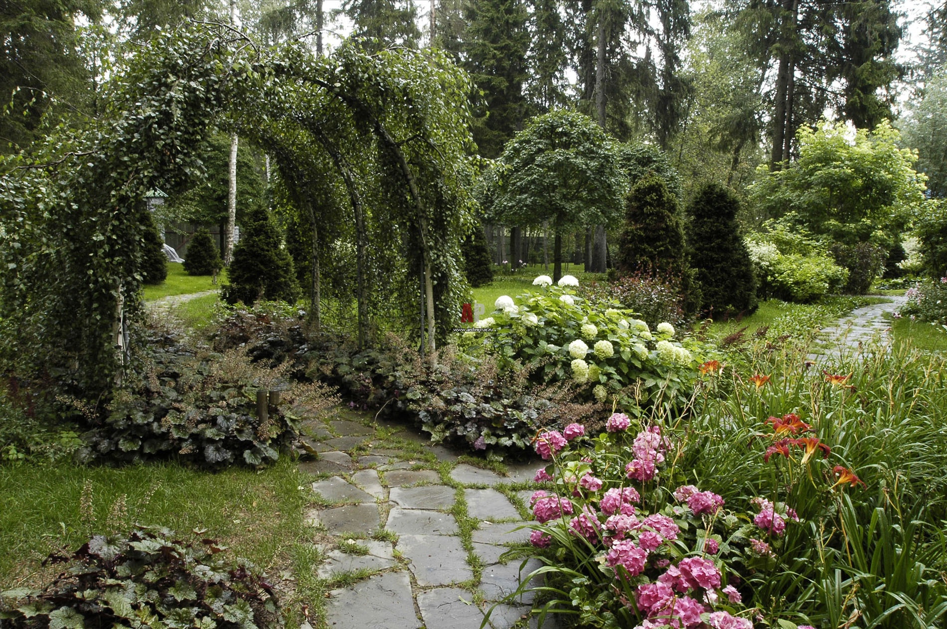 unusual landscaping of the courtyard in the English style with trees