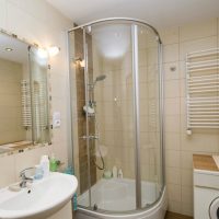 light design of a bathroom with a shower in dark colors photo