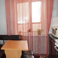 unusual curtains of thread in the interior of the kitchen photo