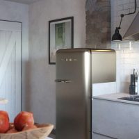 a small refrigerator in the decor of the kitchen in beige color photo