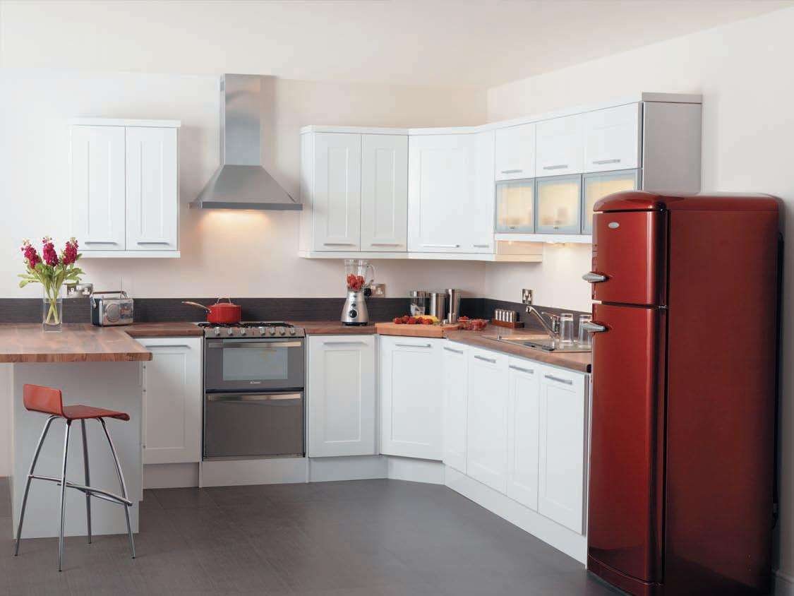 a small refrigerator in the decor of the kitchen in bright color