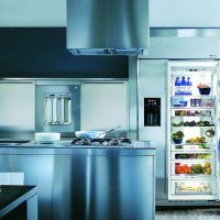 a small refrigerator in the interior of the kitchen in white color picture