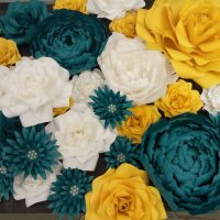 multicolored paper flowers in the facade of the festive hall photo