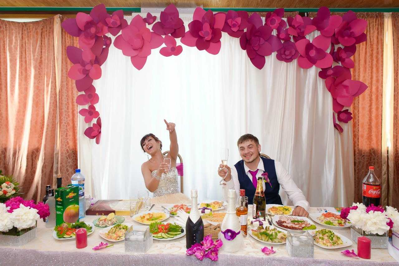 multi-colored paper flowers in the interior of the festive hall