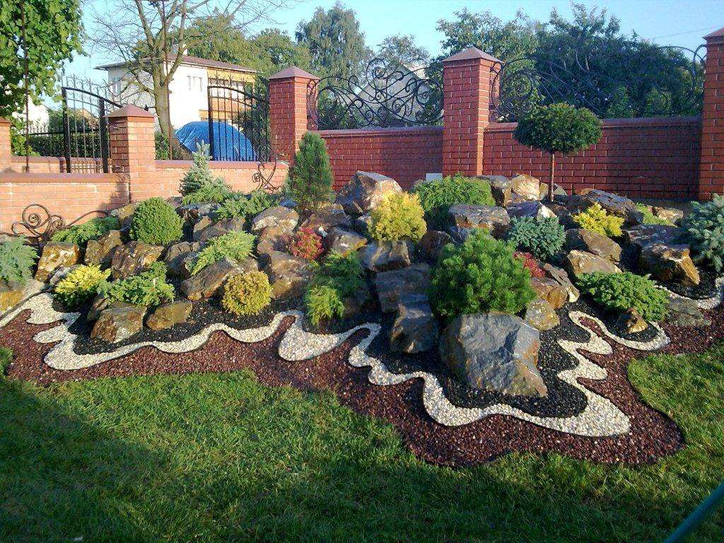 small bright flowers in the landscape design of the flowerbed