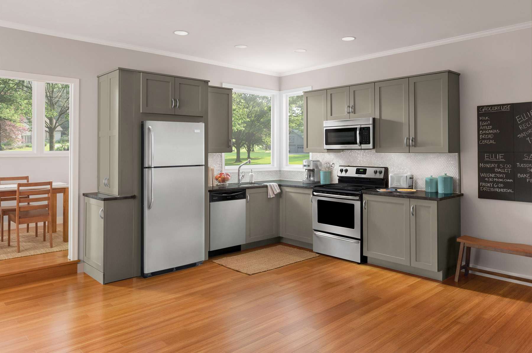 small refrigerator in the facade of the kitchen in dark color