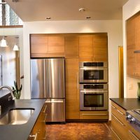 a small refrigerator in the design of the kitchen in bright color picture