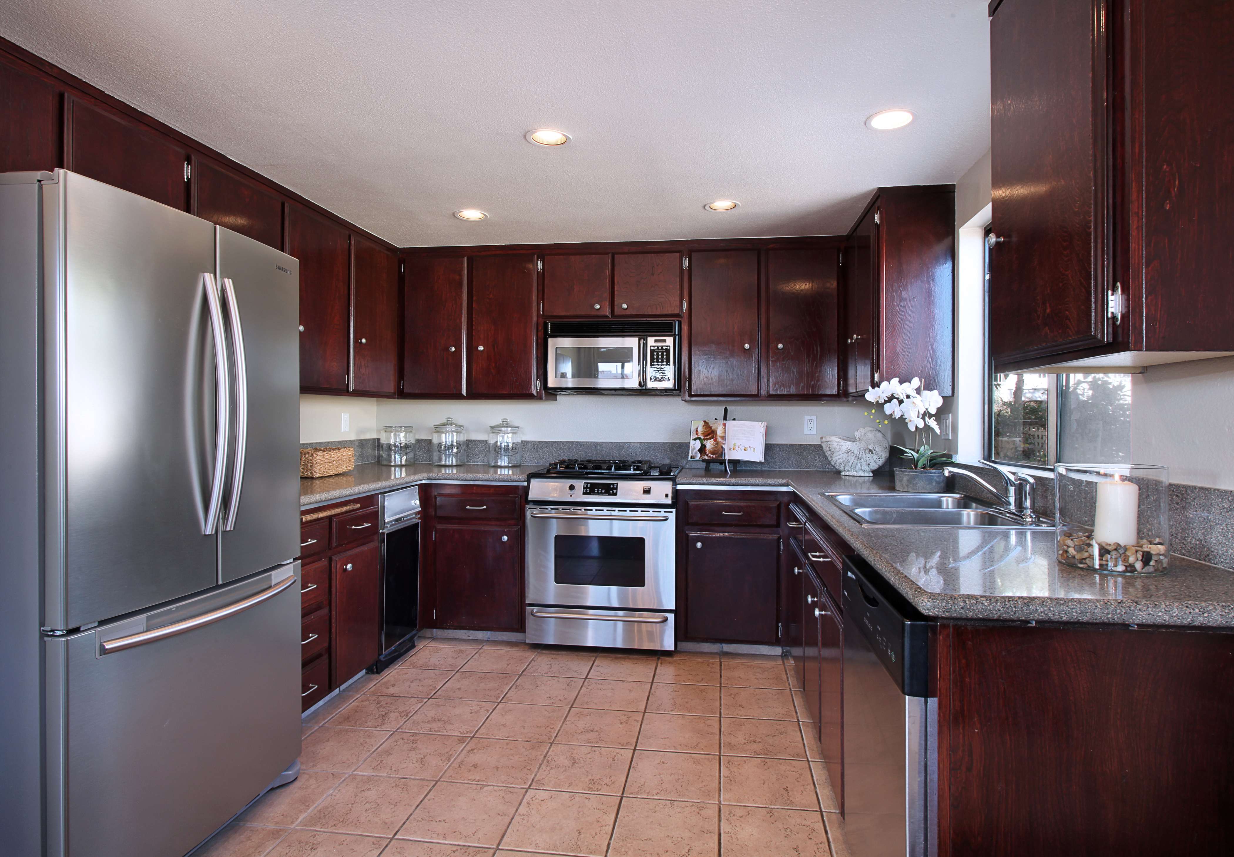 a small refrigerator in the decor of the kitchen in multi-colored