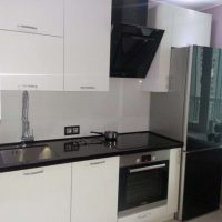 large refrigerator in the interior of the kitchen in beige color picture