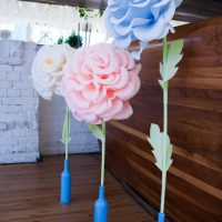 blue paper flowers in the facade of the festive hall photo