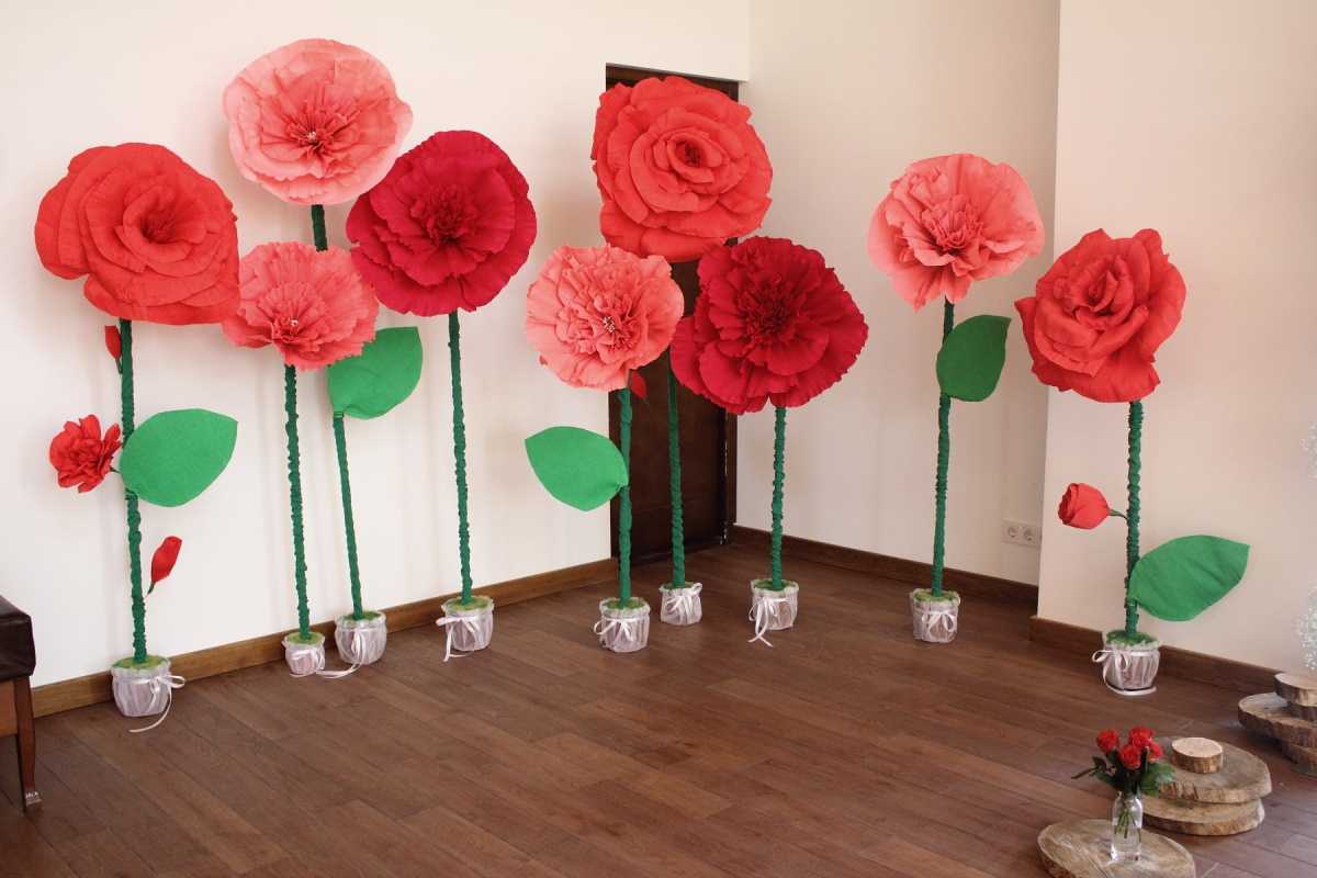 red paper flowers in the facade of the festive hall