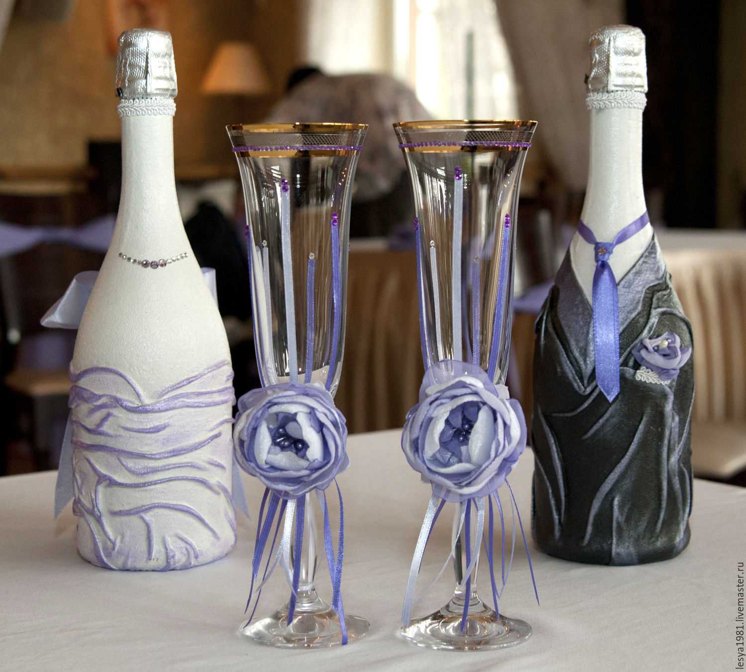 bright decoration of champagne bottles with decorative ribbons