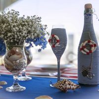 unusual decoration of champagne bottles with colorful ribbons photo