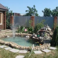 unusual creation of the design of a summer cottage with stones photo