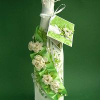 bright decoration of glass bottles with decorative ribbons picture