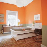 a combination of light orange in the style of the bedroom with other colors of the photo