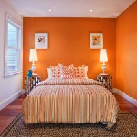 a combination of bright orange in the home decor with other colors of the photo