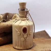 do-it-yourself version of a beautiful decor of glass bottles of leather