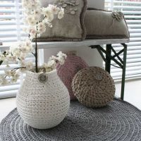 crocheted pillows in the bedroom interior photo