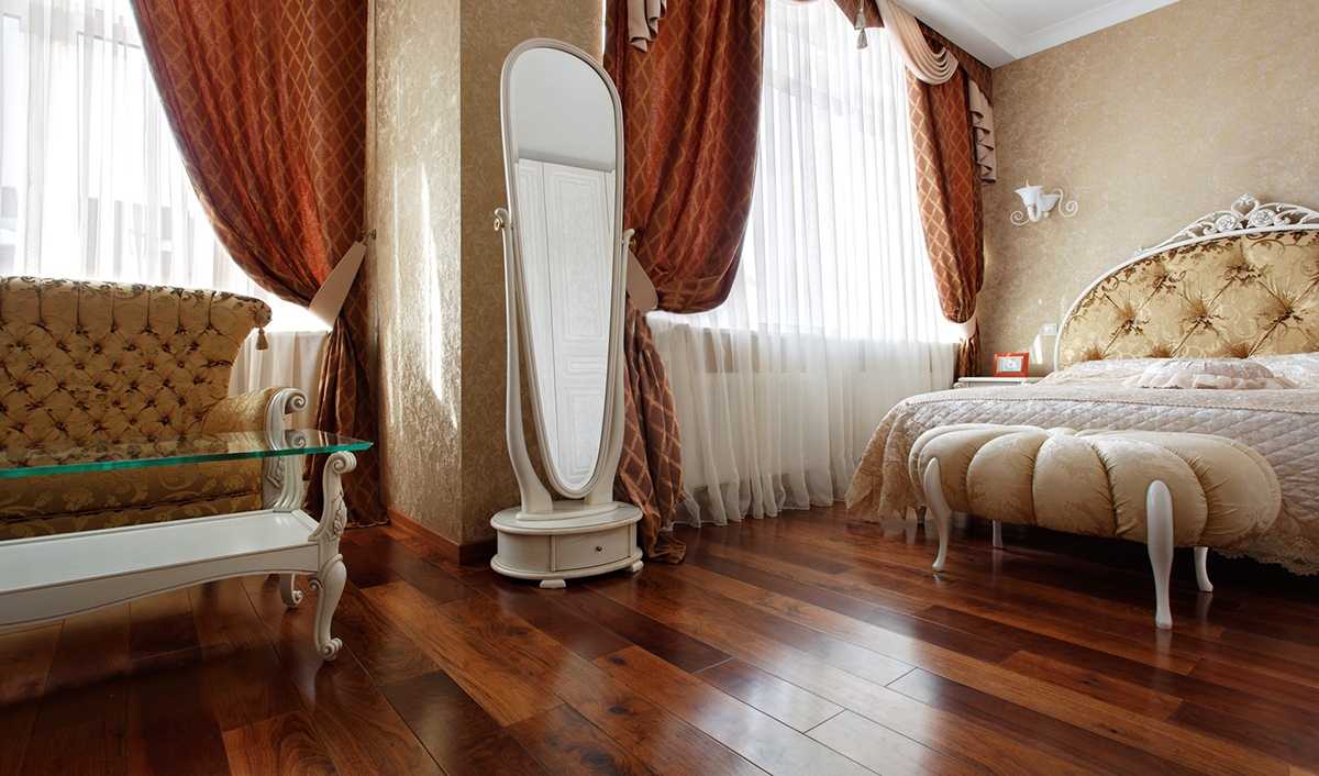 unusual dark floor in the design of the bedroom