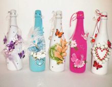 original design of glass bottles with decorative ribbons photo