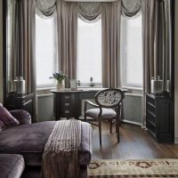 example of a light living room decor with bay window photo