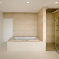 An example of a light bathroom interior in beige color picture