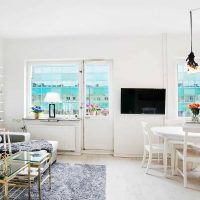 the idea of ​​using a light laminate in a beautiful apartment style photo