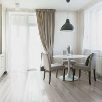 the idea of ​​using a light laminate in a bright apartment style photo