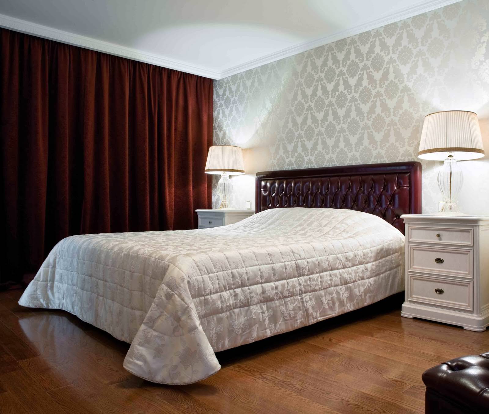 bedroom with gray wallpaper and red curtains