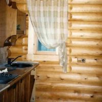 an example of an unusual style of kitchen in a wooden house picture