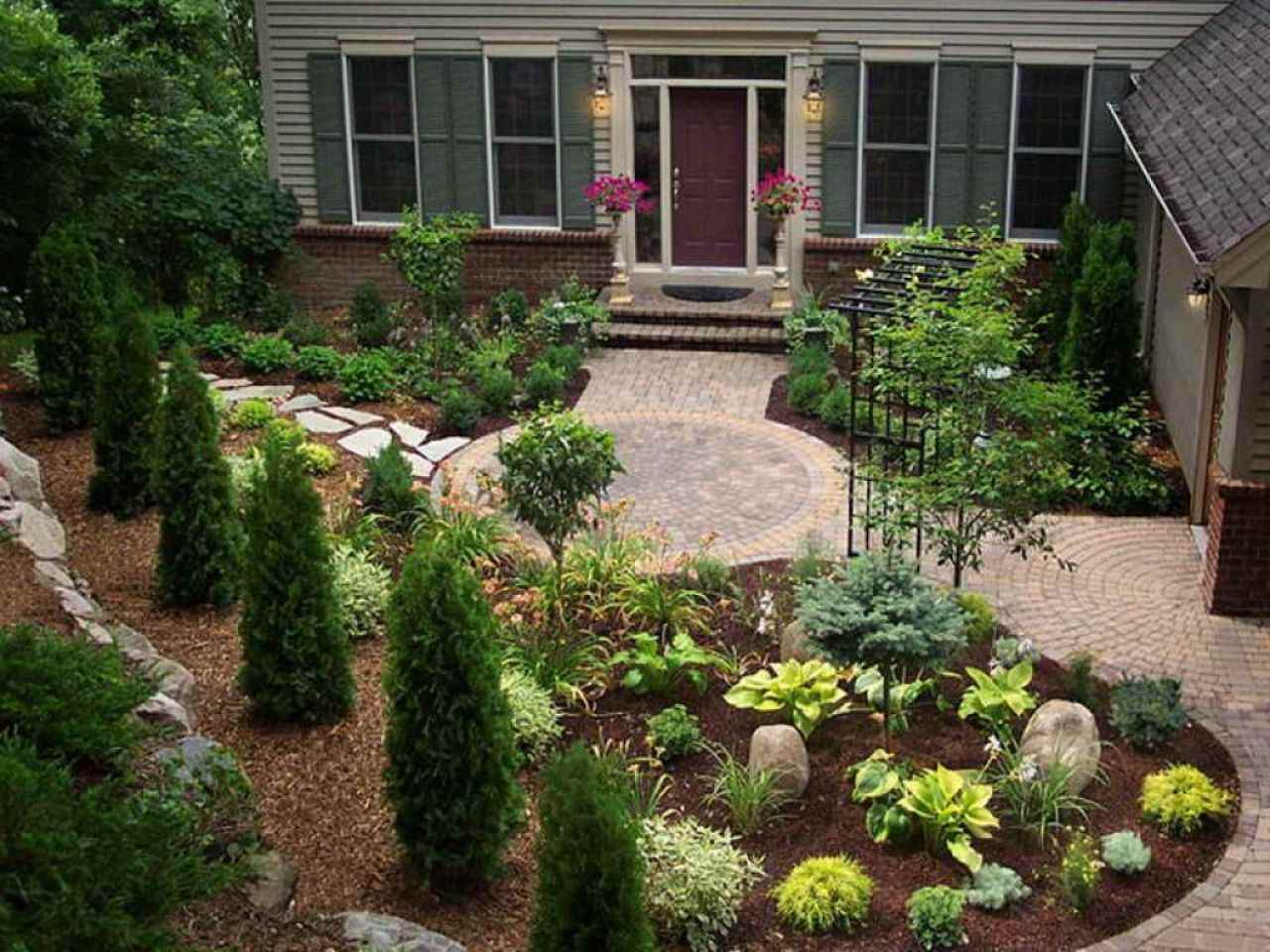 An example of an unusual design of a front garden in the country