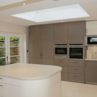 kitchen design with a window in beige tones