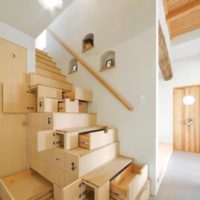 staircase in the hallway with drawers