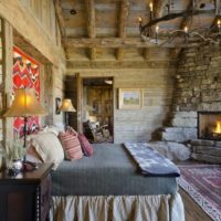 bedroom in a wooden house with fireplace