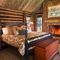 bedroom in a wooden house with masonry