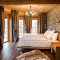 bedroom in a wooden house modern interior