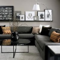 Shelf with paintings over the sofa in the living room