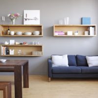 Shelves with dishes on the wall in the living room